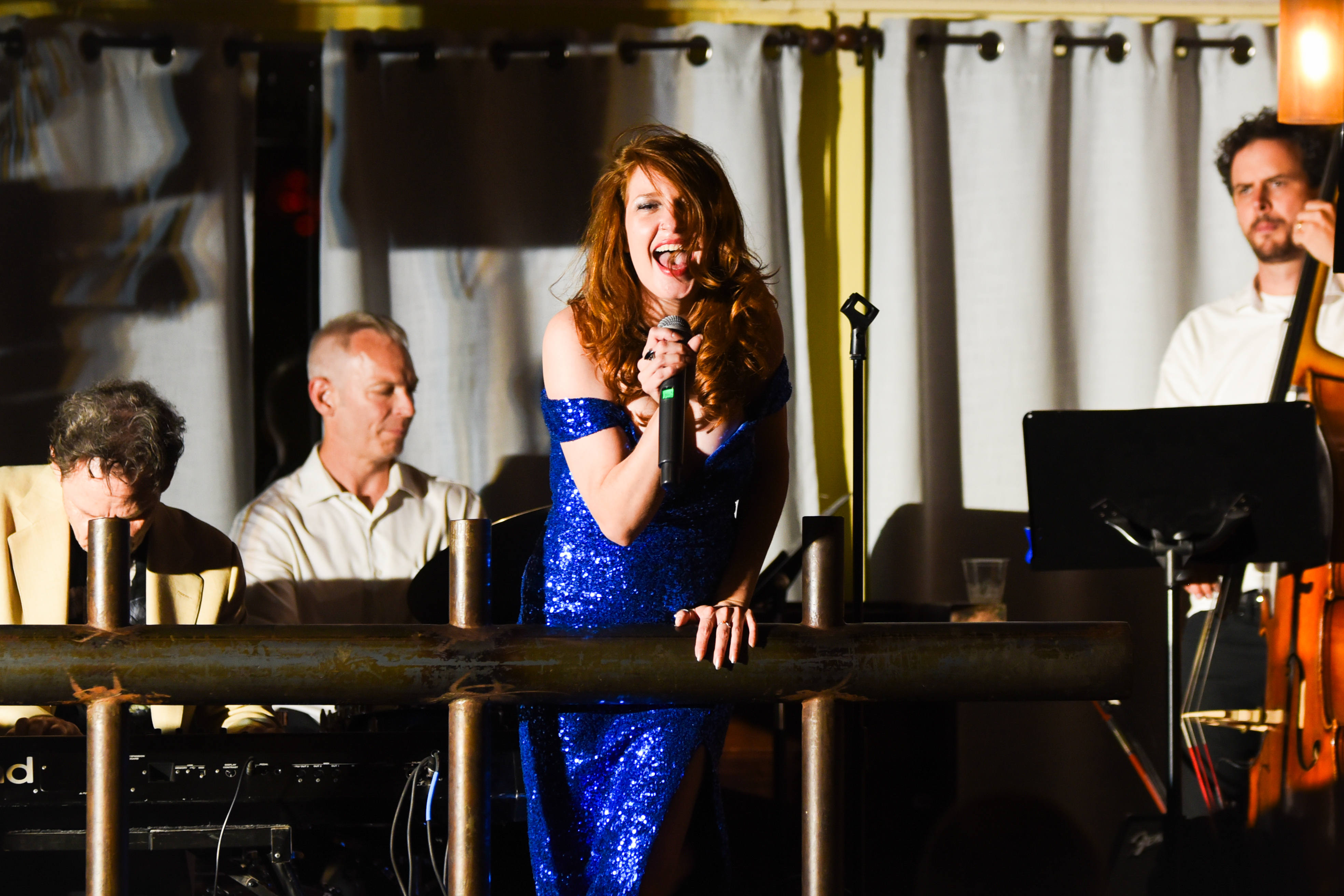 Vocalist singing with passion on stage